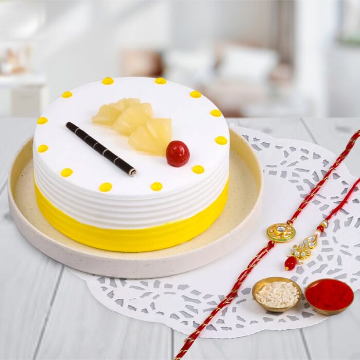 Kundan Couple Rakhi With Pineapple Cake